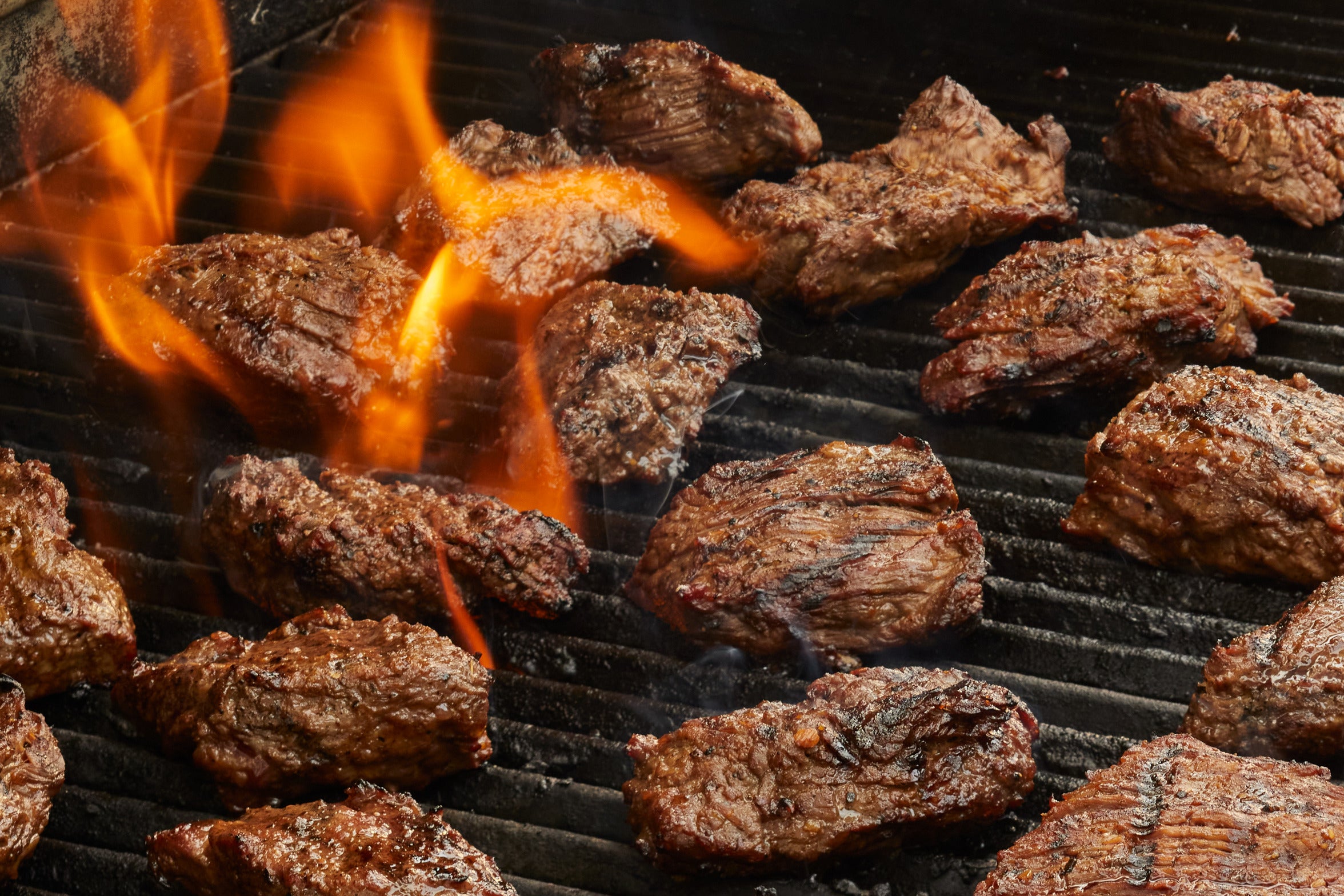 Bianco & Sons quality meat seasoned and cooking on the grill