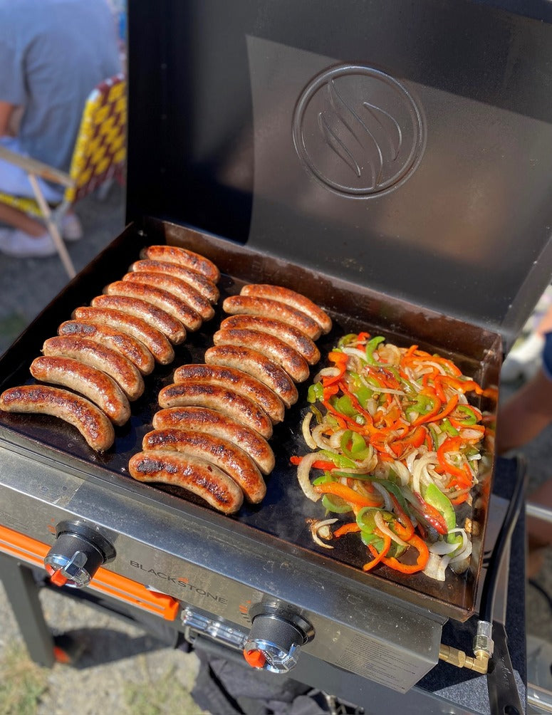 Bianco and Sons quality sausage links and sliced peppers, cooking on the grill