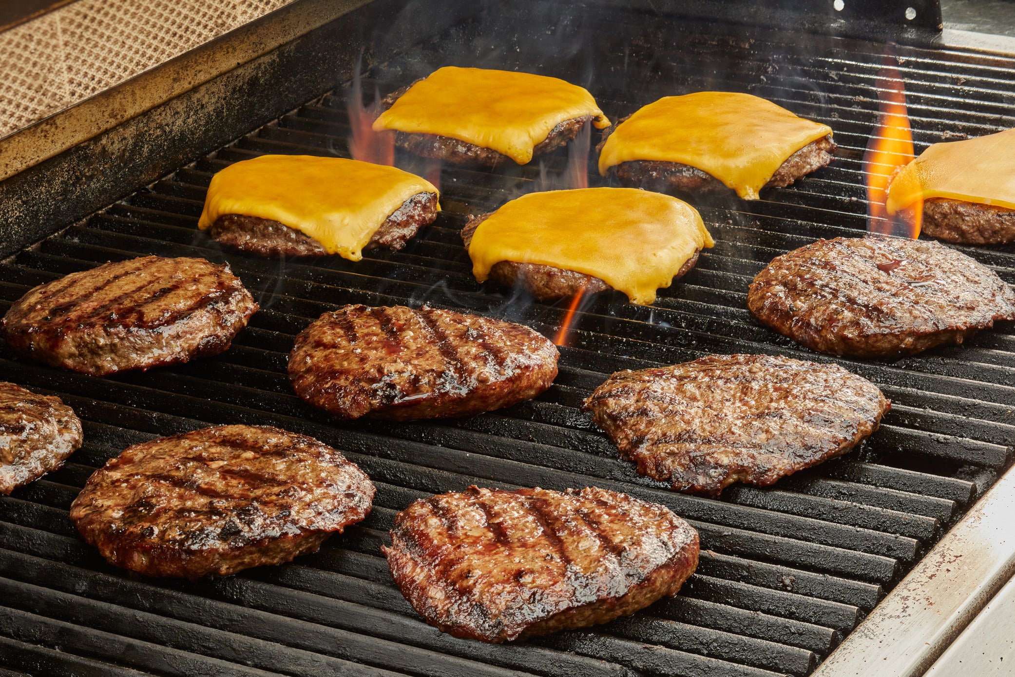 Bianco and Sons quality burgers cooking on the grill