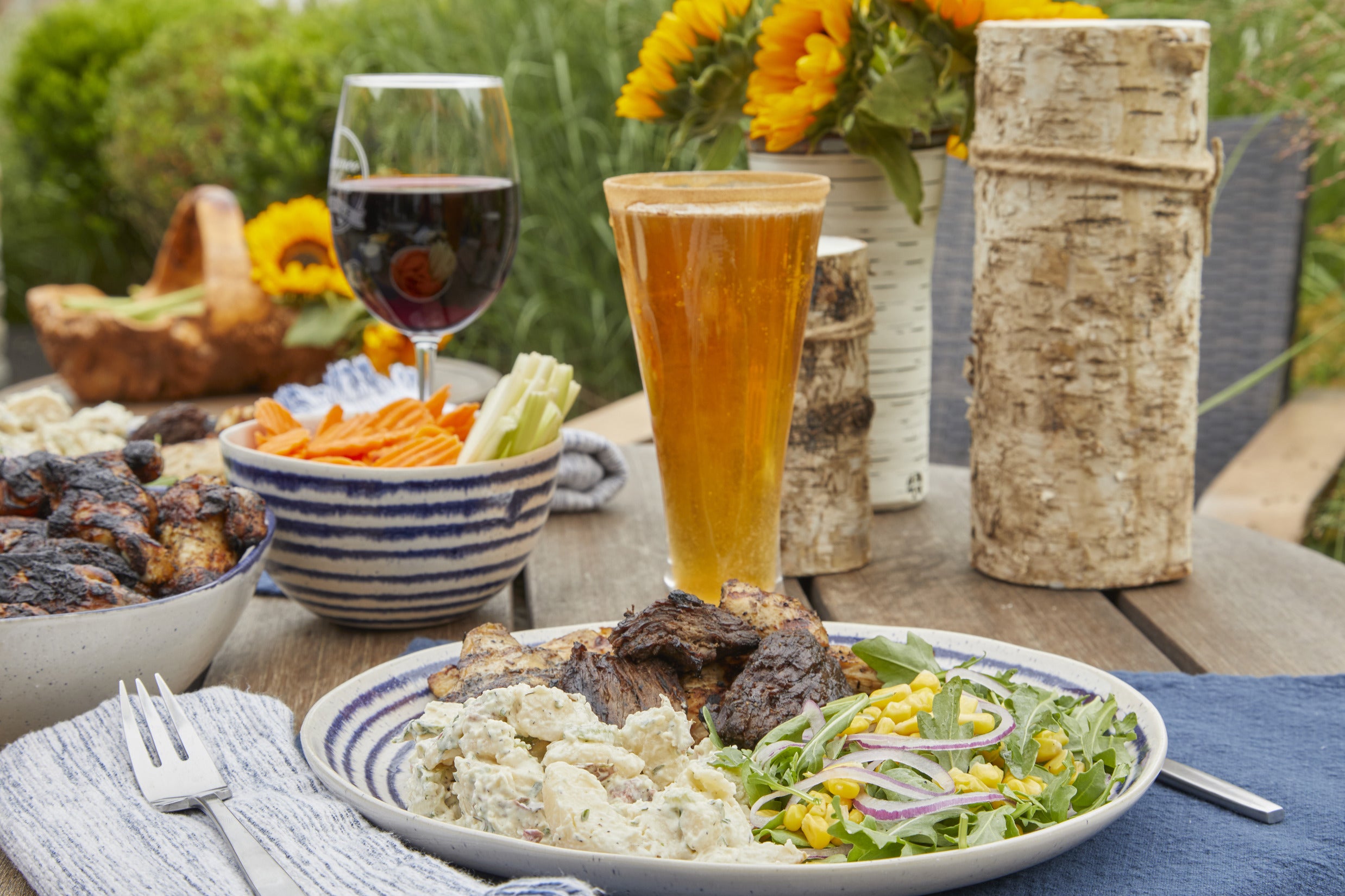 Bianco and Sons quality meats, cooked and plated at a summer cookout